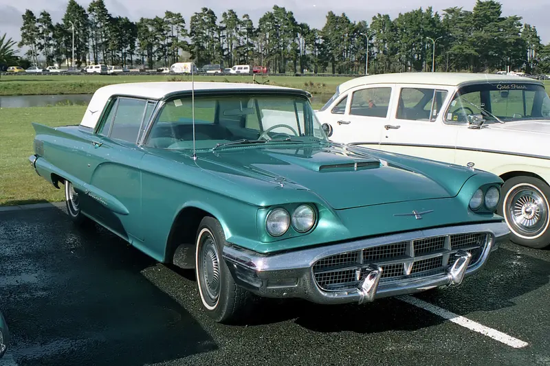 Turquoise 1960 Ford Thunderbird hardtop parked at a car show